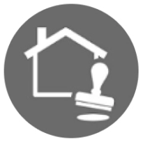 A gray circle with a house and a stamp in the middle.