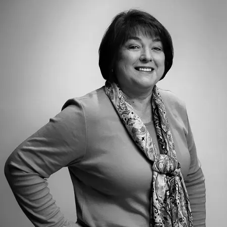 A black and white photo of a woman in a sweater