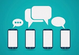 Four smart phones with speech bubbles above them.